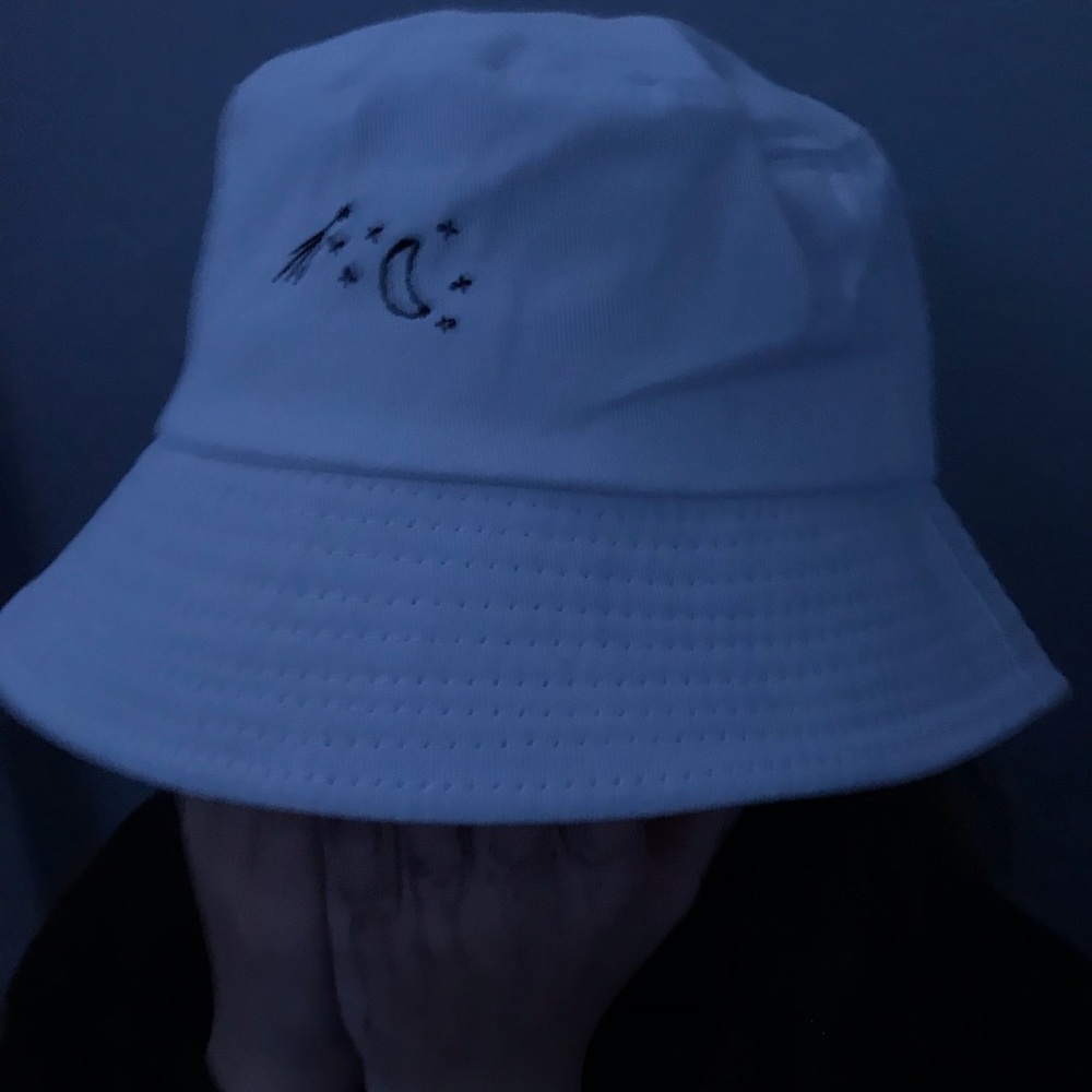 White bucket hat with stars and a moon
